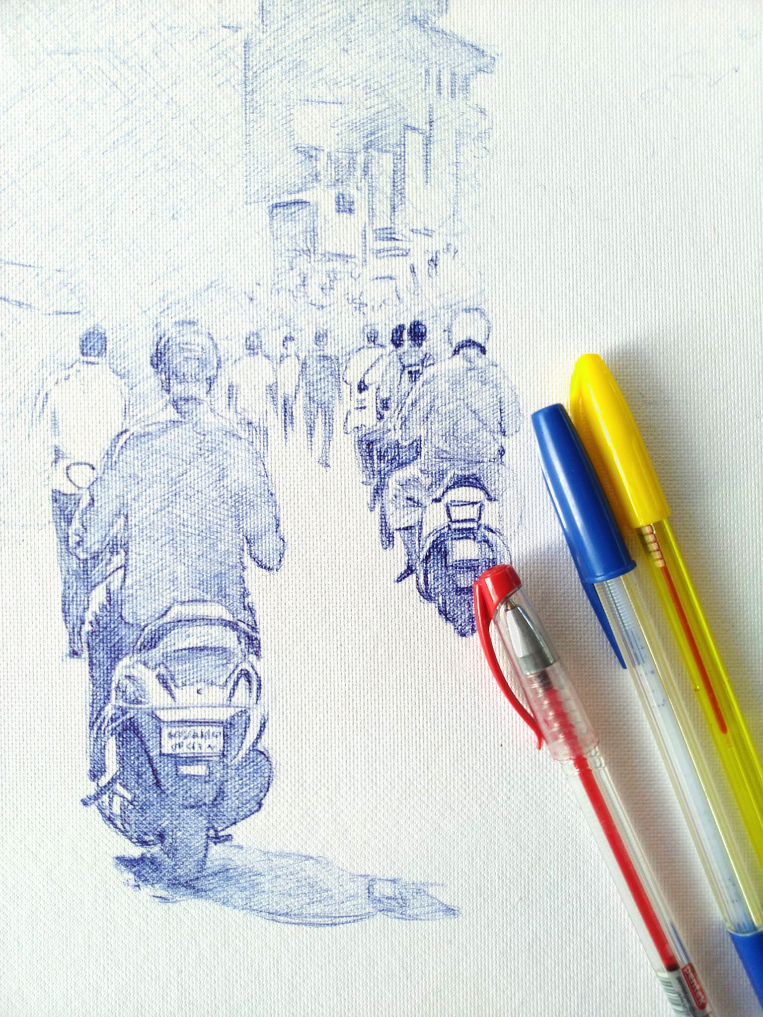 A ballpoint drawing in progress, with three pens beside it